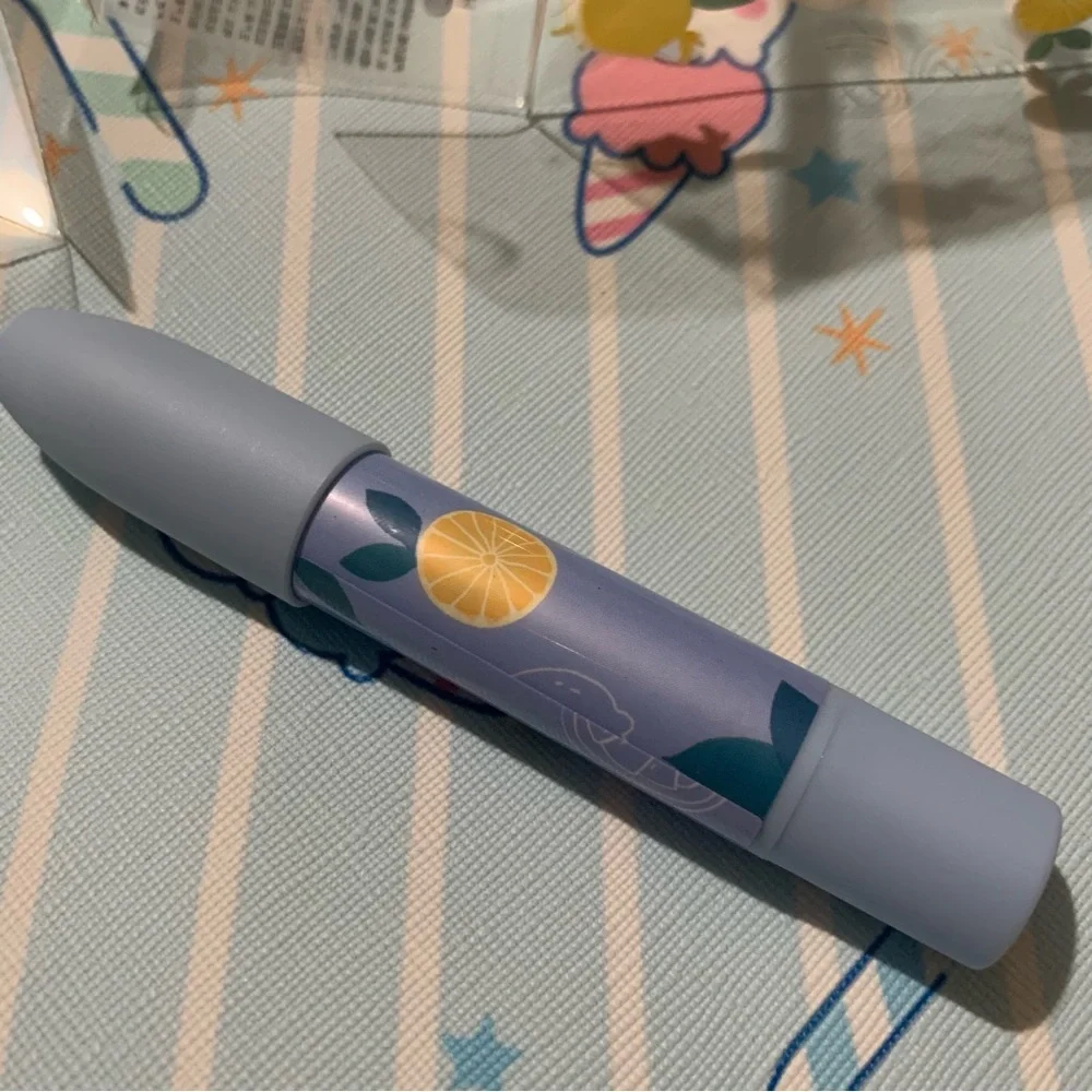 Red Twist-Up Lip Crayon in Triangle Packaging with Hang String